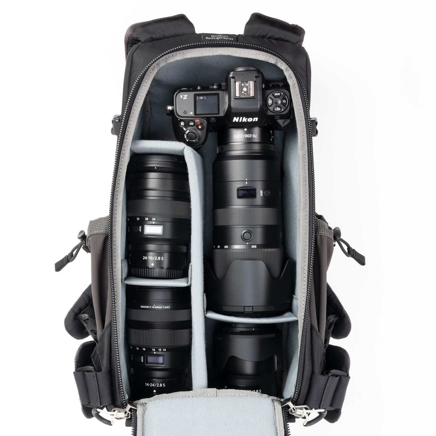 
                  
                    Holds a standard-sized camera body
with lenses attached and 1–3 standard zoom lenses
                  
                