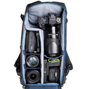 Holds a standard-sized camera body with lenses attached and 1–3
standard zoom lenses