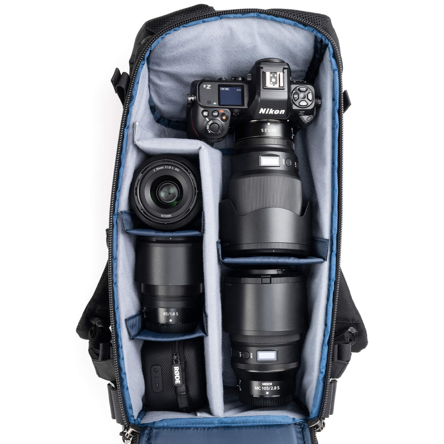 
                  
                    Holds a standard-sized camera body with lenses attached and 1–3
standard zoom lenses
                  
                