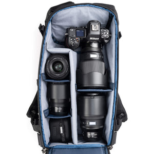 Holds a standard-sized camera body with lenses attached and 1–3
standard zoom lenses