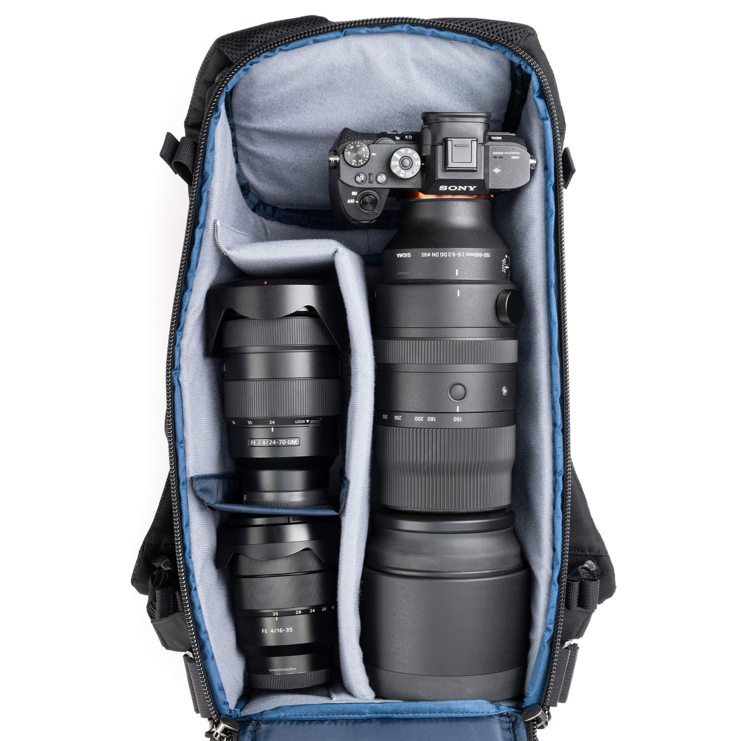 
                  
                    Holds a standard-sized camera body with lenses attached and 1–3
standard zoom lenses
                  
                