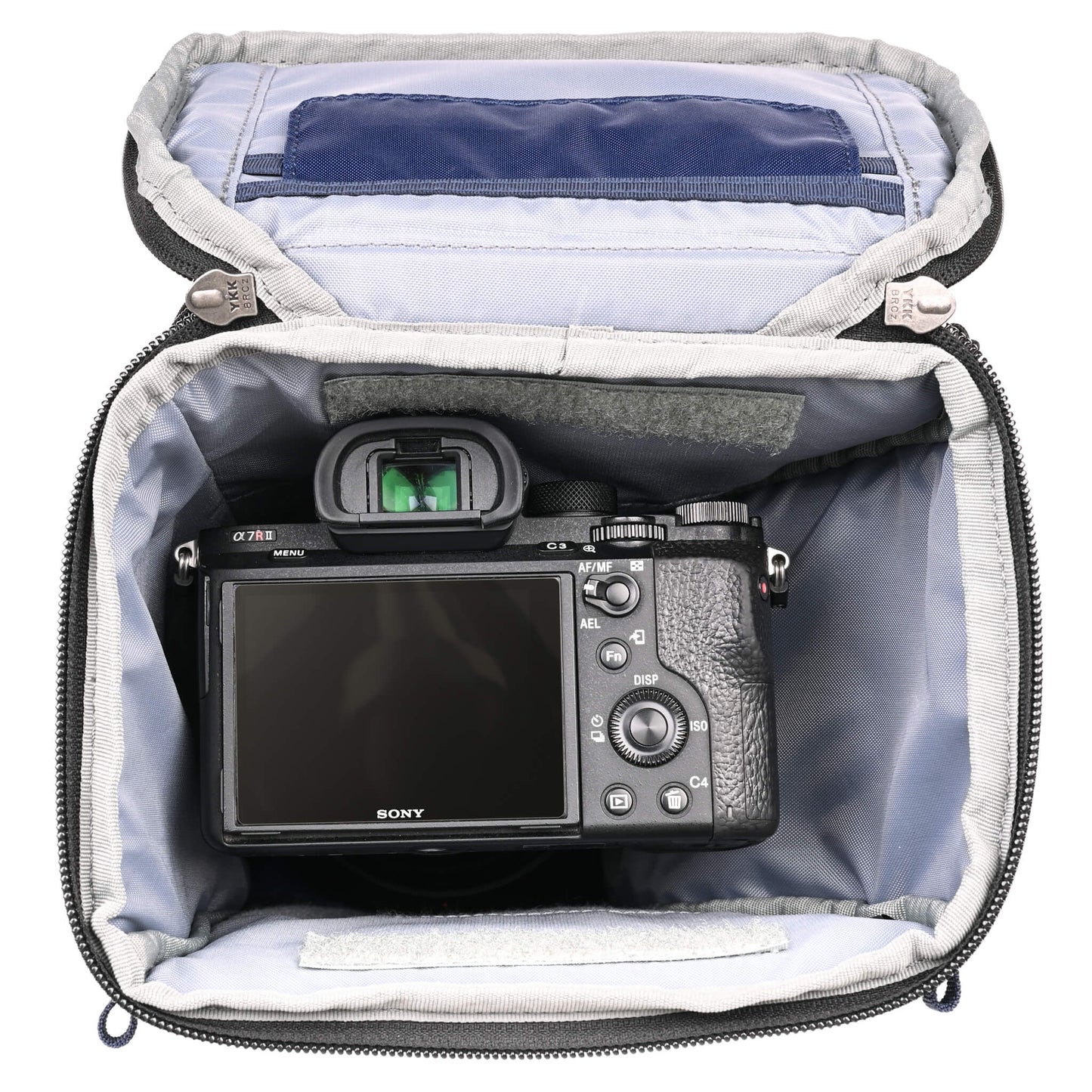 
                  
                    Fits a standard-size mirrorless camera body with a 24-70mm f/2.8 attached with the hood reversed. Popped-down, it fits a 70-200mm f/2.8 with its hood reversed.
                  
                