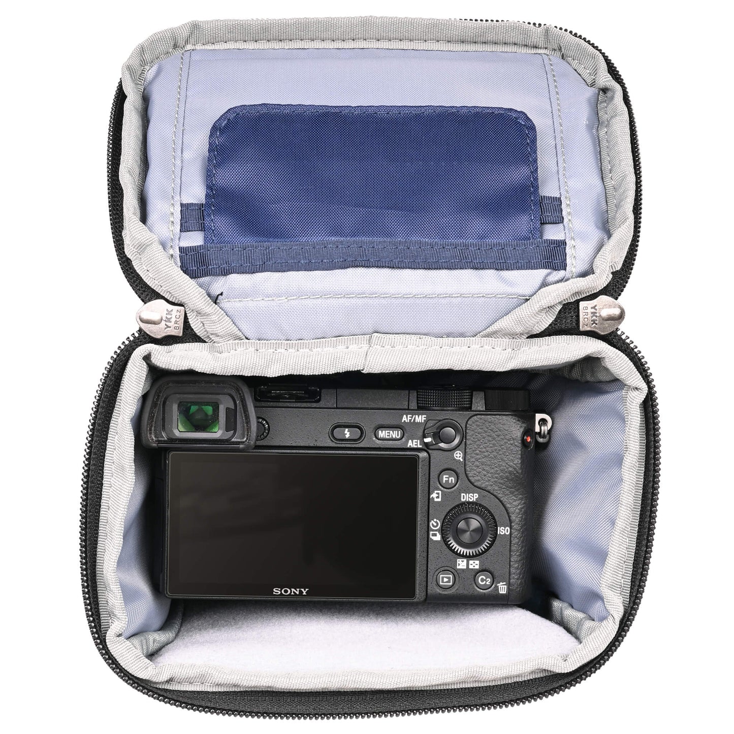 
                  
                    Fits compact mirrorless body, such as a Canon R50 or R10, Nikon Z5, Fuji X-T30, or Sony A6000 series body with a short lens attached.
                  
                