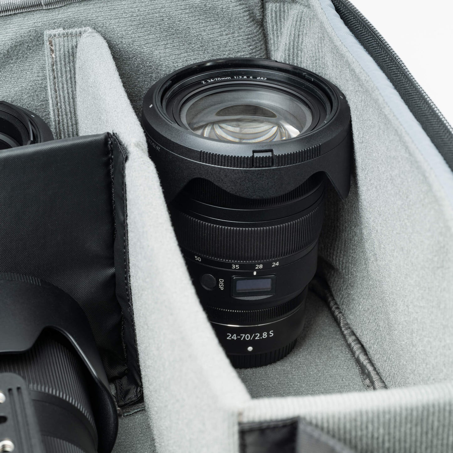 
                  
                    Deep photo compartment for gripped bodies and vertical storage of long lenses
                  
                