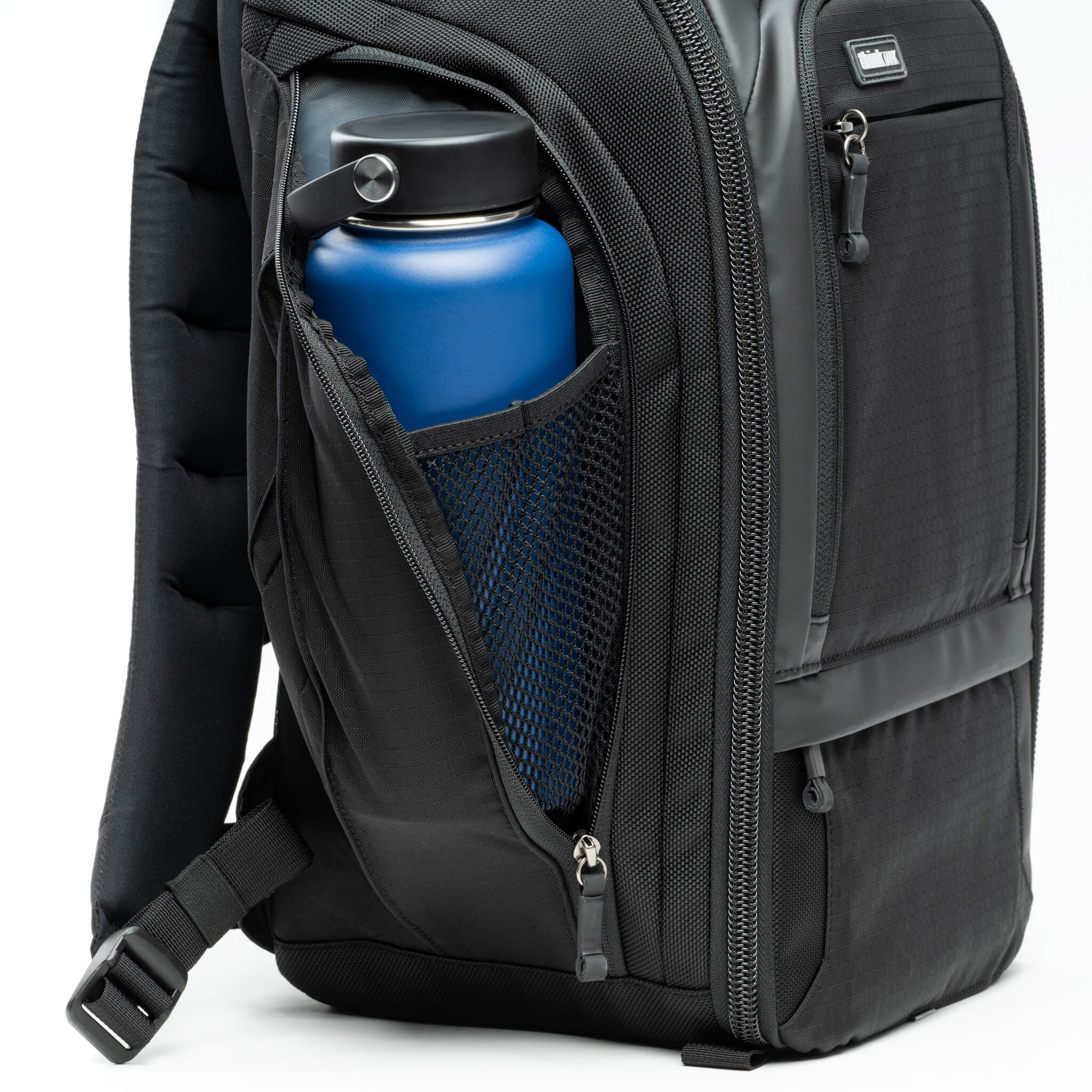 Pleated side pockets expand while closed or unzip for taller water bottles or small to medium tripods