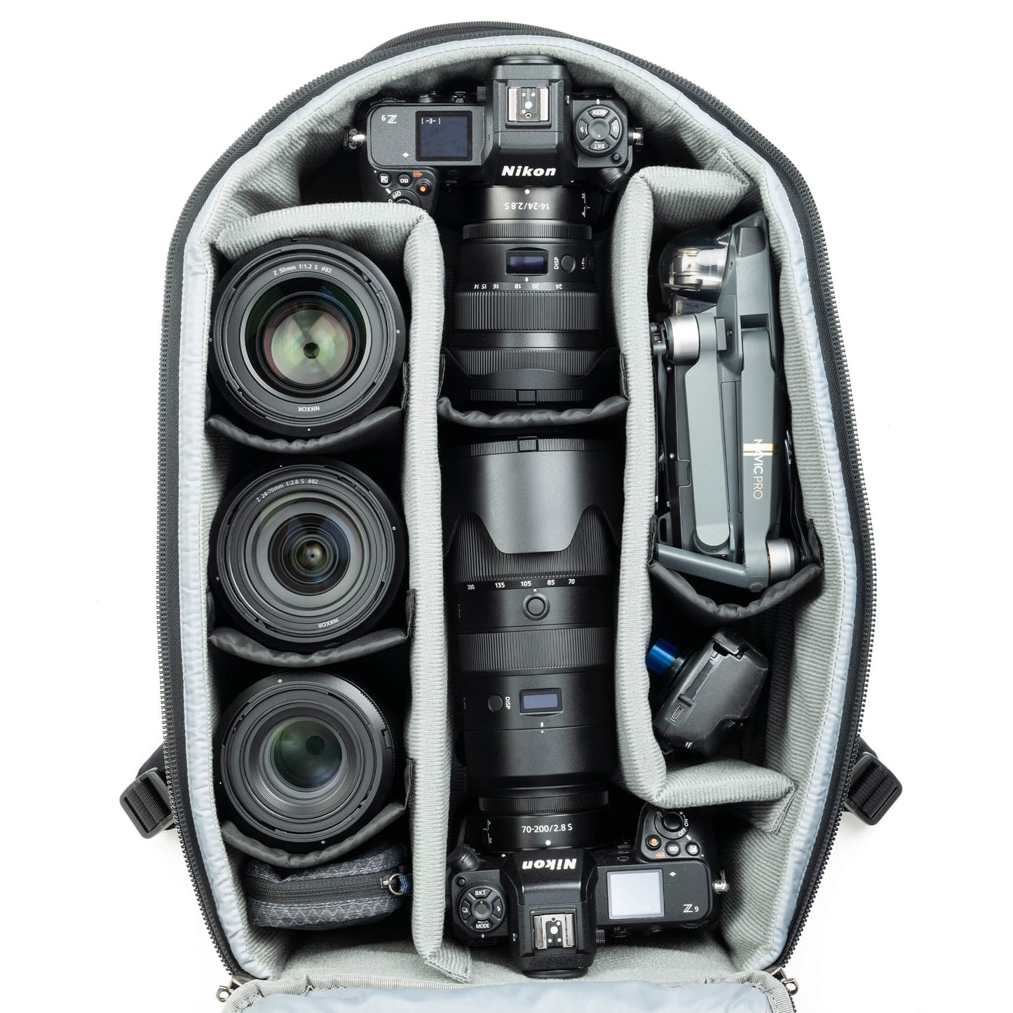 Fits two gripped camera bodies with lenses attached and an additional
4-6 standard zoom lenses